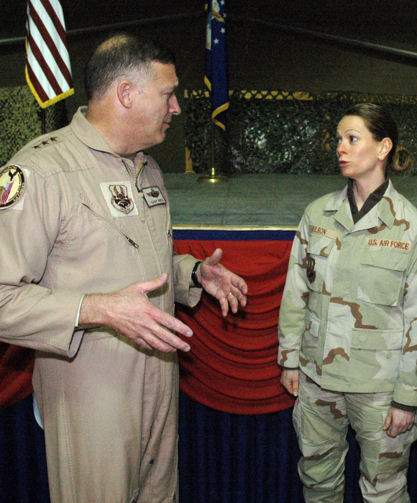 Lt. Gen. Gary North speaks with Tech. Sgt. Robyn Wilson about her ideas for streamlining the flow of transient ground forces during a visit to Manas Air Base, Kyrgyzstan, March 7.  Sergeant Wilson is deployed the 376th Expeditionary Logistics Readiness Squadron from the 87th Aerial Port Squadron at Wright-Patterson Air Force Base, Ohio. General North is the commander of 9th Air Force and U.S. Central Command Air Forces at Shaw Air Force Base, S.C. (U.S. Air Force photo/Master Sgt. Daniel Nathaniel) 