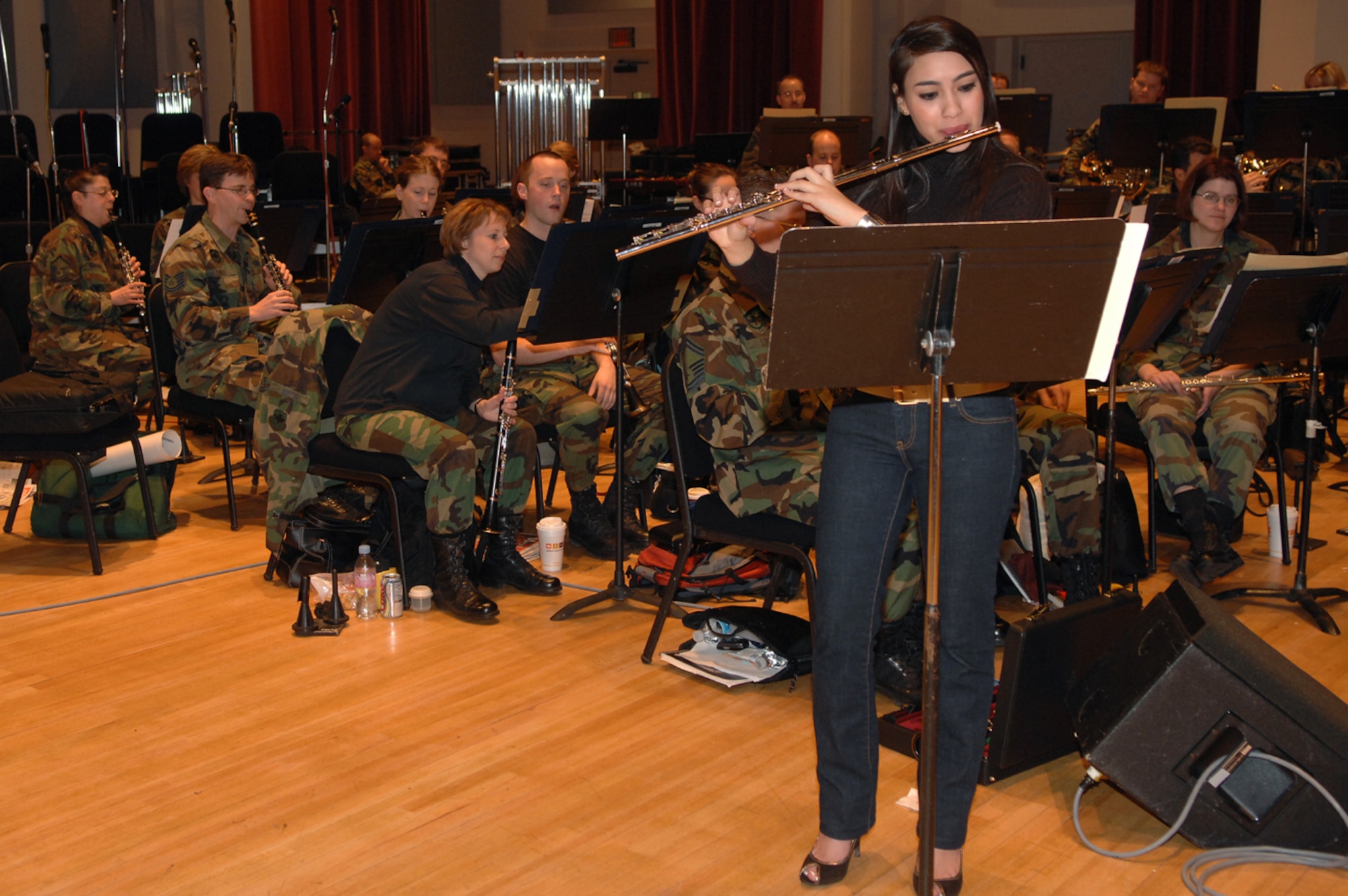 Betty Macias practices a flute solo with the U.S Air Force Band for her upcoming performances during the Guest Artist Series concert at the Daughters of the American Revolution Hall in Washington March 4. Ms. Macias was the 2007 winner of the Col. George S. Howard Young Artist competition. (U.S. Air Force photo by Airman 1st Class Timothy Chacon)