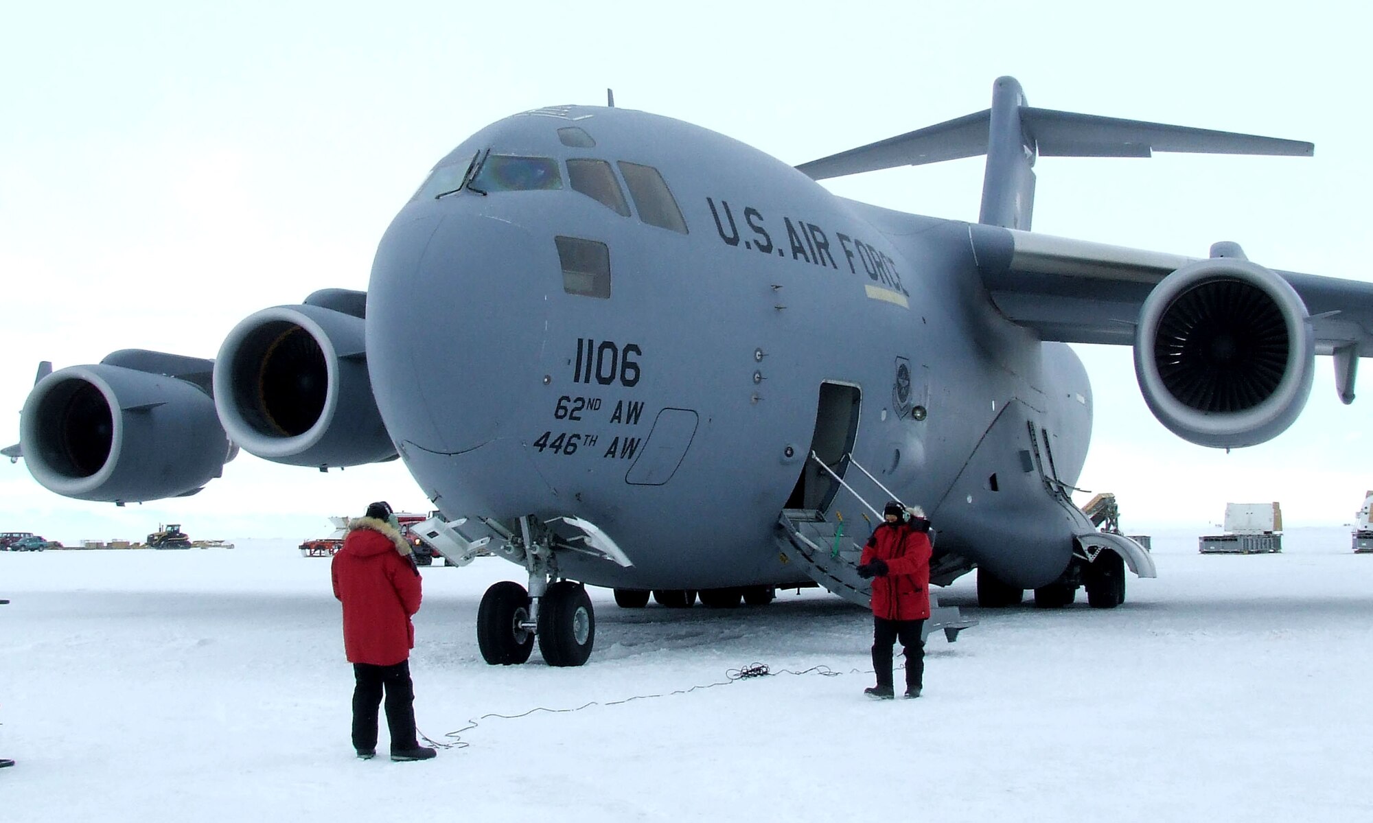 Senior Airman Kory Williams, left, and Senior Master Sgt. David Stutts assess the C-17 Globemaster III's condition after landing on the ice runway Nov. 16 at McMurdo Station, Antarctica. The jet, from McChord Air Force Base, Wash., shuttled supplies, equipment and personnel for Operation Deep Freeze. Airman Williams is from the 8th Airlift Squadron and Sergeant Stutts is from the 313th AS. (U.S. Air Force photo/1st Lt. Erika Yepsen)