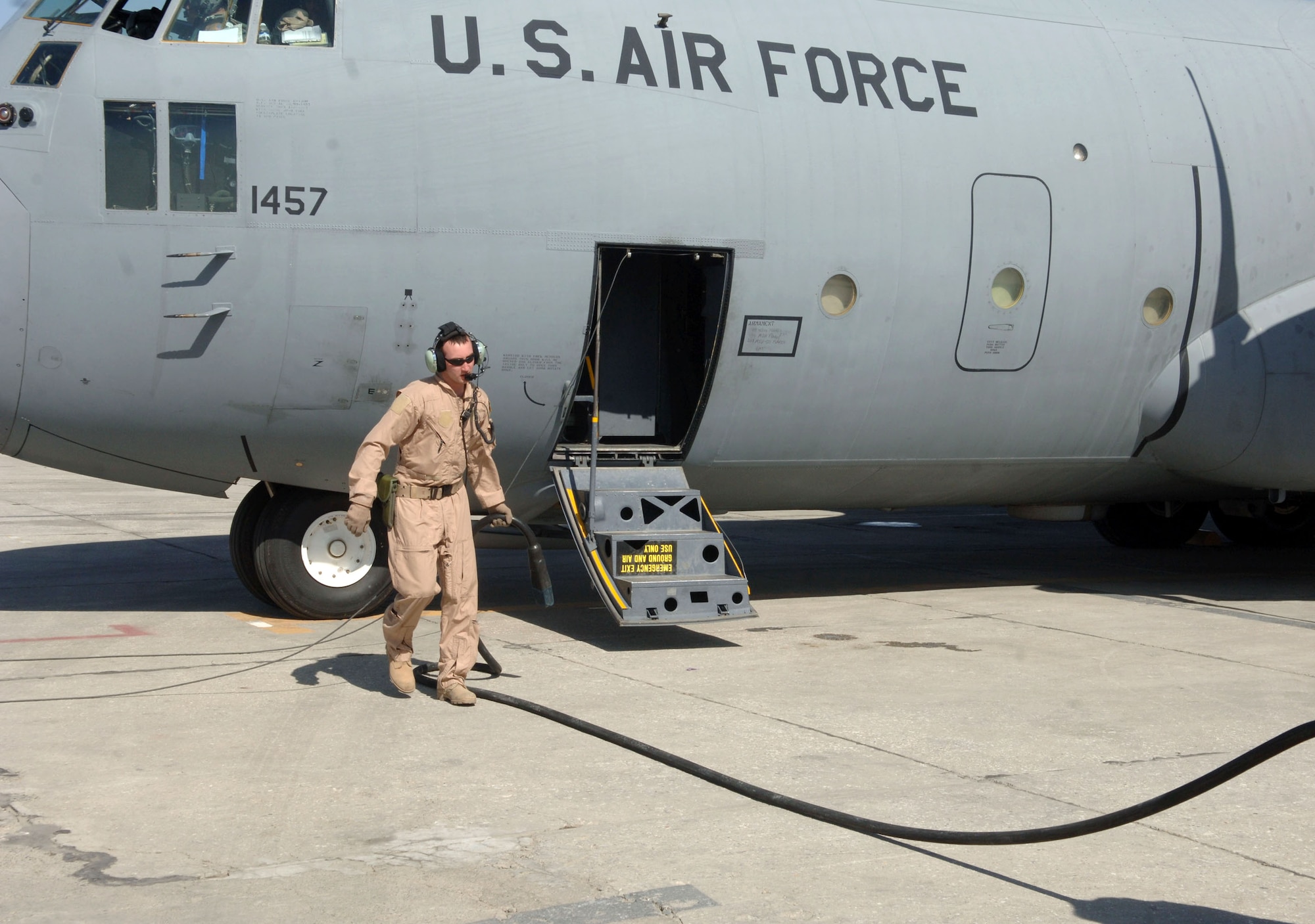 026: Senior Airman Davey Black, a loadmaster with the 774th Expeditionary Airlift Squadron, disconnects a power cart from a C-130 Hercules at Bagram Airfield, Afghanistan prior to departure March 7.  The C-130 is just one of many aircraft providing intra-theater heavy airlift support daily to Operation Enduring Freedom, helping to sustain operations across Afghanistan. (U.S. Air Force photo/Staff Sgt. Kevin Tomko)