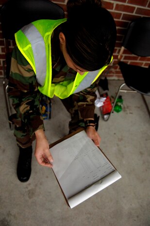 1st Lt. Deanna Minor, 437th Aerial Port Squadron Air Fright Flight commander, checks cargo paperwork during the Mobility Exercise March 1.(RELEASED)(U.S. Air Force Photo by Airman 1st Class Nicholas Pilch)