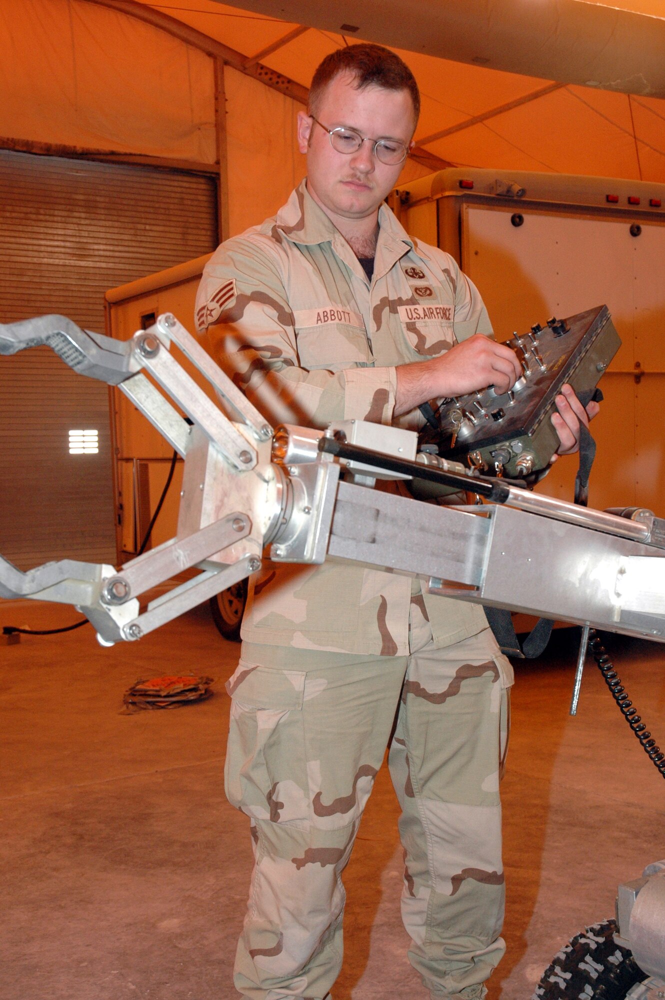 Senior Airman Matthew Abbott performs a pre-operation inspection of an explosive ordnance response robot. The function tests ensure a full range of motion before shipping it to explosive ordnance technicians uprange. Airman Abbot is an explosive ordnance disposal journeyman assigned to 379th Expeditionary Civil Engineer Squadron in Southwest Asia. (U.S. Air Force photo/Senior Airman Erik Hofmeyer) 