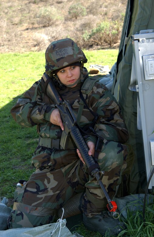 Senior Airman Amber Byrd, 30th Civil Engineer Squadron, takes cover and prepares to return fire during an enemy attack at North Star on Feb.23.  (U.S. Air Force photo by Staff Sgt. Jamie Lessard)                                                                              