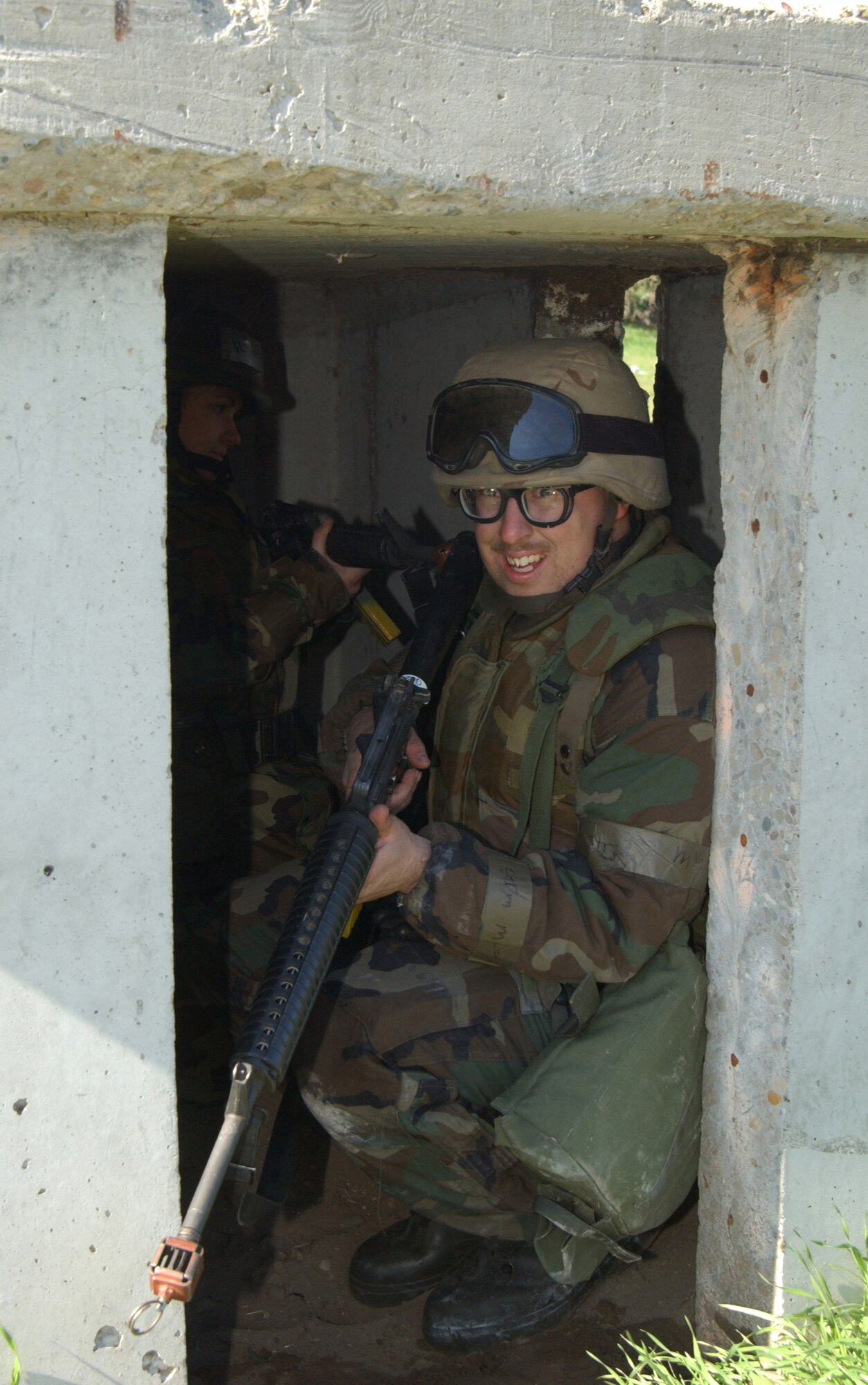 Senior Airman Joseph Maier, 30th Logistics Readiness Squardon, takes cover during an enemy attack at North Star on Feb. 23.  (U.S. Air Force by Staff Sgt. Jamie Lessard)                                                                                 