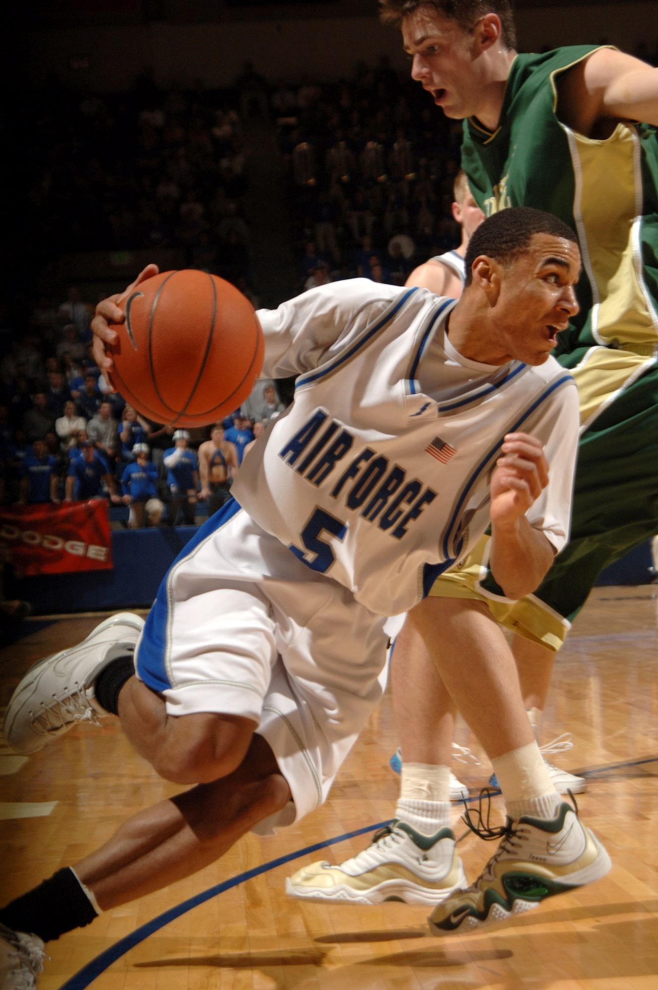 Air Force Academy senior guard Matt McCraw drives past a Colorado State University defender Feb. 17 during a game in Clune Arena on Academy grounds. McCraw was named to the Mountain West Conference All-Conference team Monday by league coaches and media. (U.S. Air Force photo/1st Lt. John Ross)