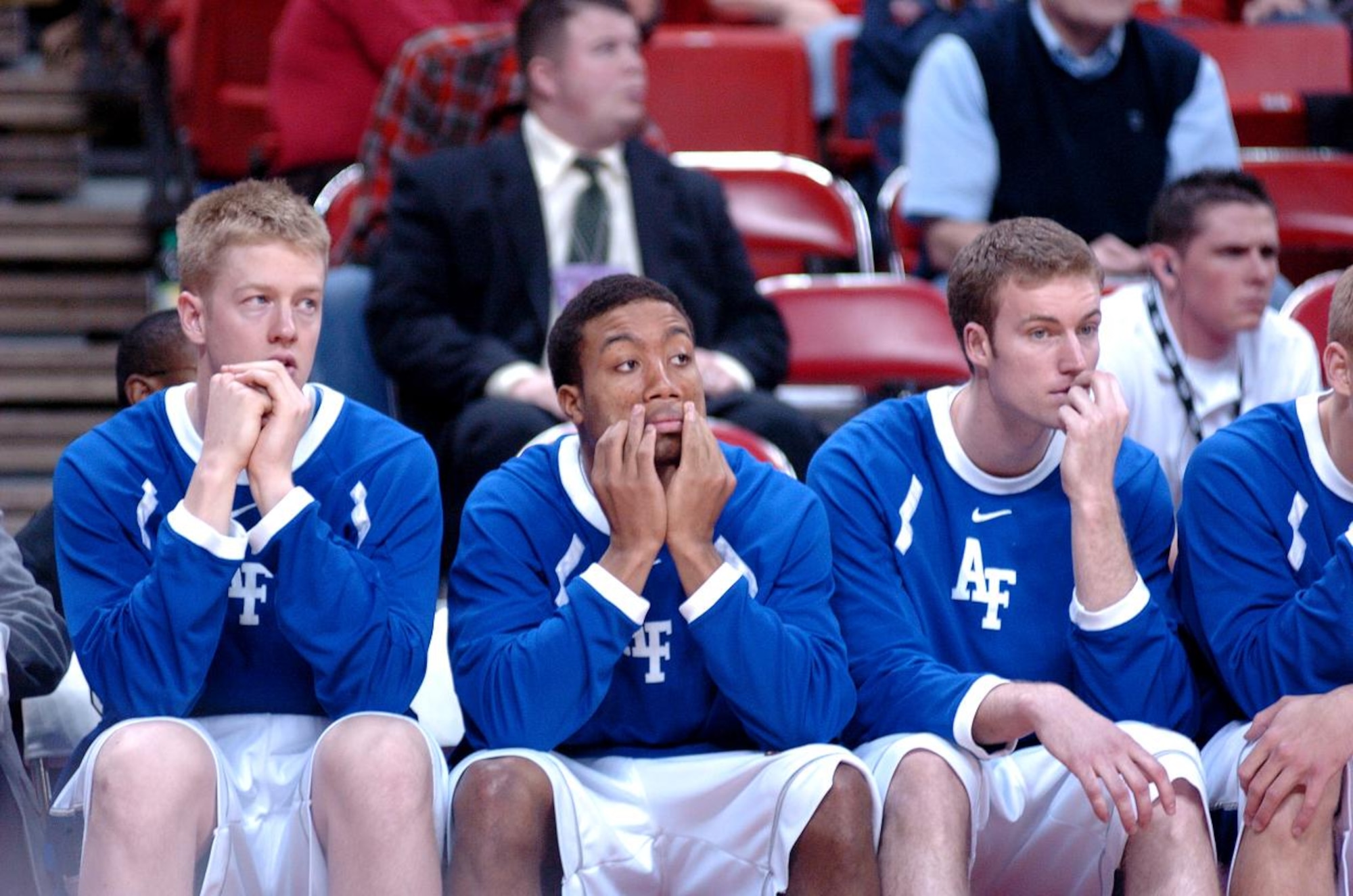 Air Force basketball players Grant Parker, Saj El-Amin and Eric Kenzik look on in dismay as Air Force trails Wyoming in the closing minutes of their game at the Mountain West Conference tournament in Las Vegas Thursday, March 8. Nationally ranked nearly the entire season, the Falcons were eliminated in their first game of the tourney, 67-62. Air Force now has an all-time record of 0-8 in the MWC tournament. (U.S. Air Force photo/1Lt John Ross)