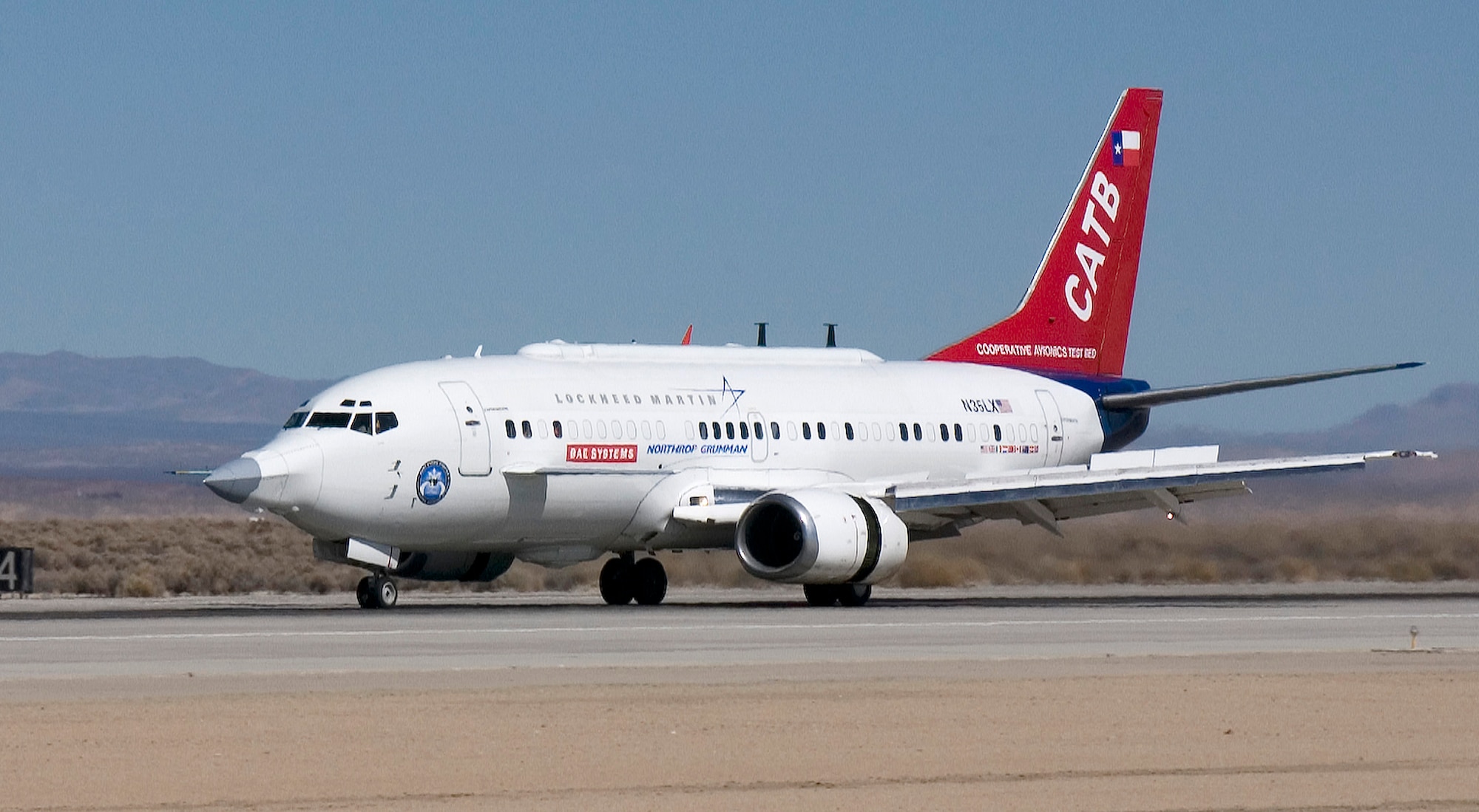 The F-35 Joint Strike Fighter program's Cooperative Avionics Test Bed, or CATB, aircraft lands here March 1, 2007, to perform equipment fit checks. The aircraft is a Boeing 737-300 specially modified to perform mission systems testing for the F-35 program. (Photo by Chad Bellay)