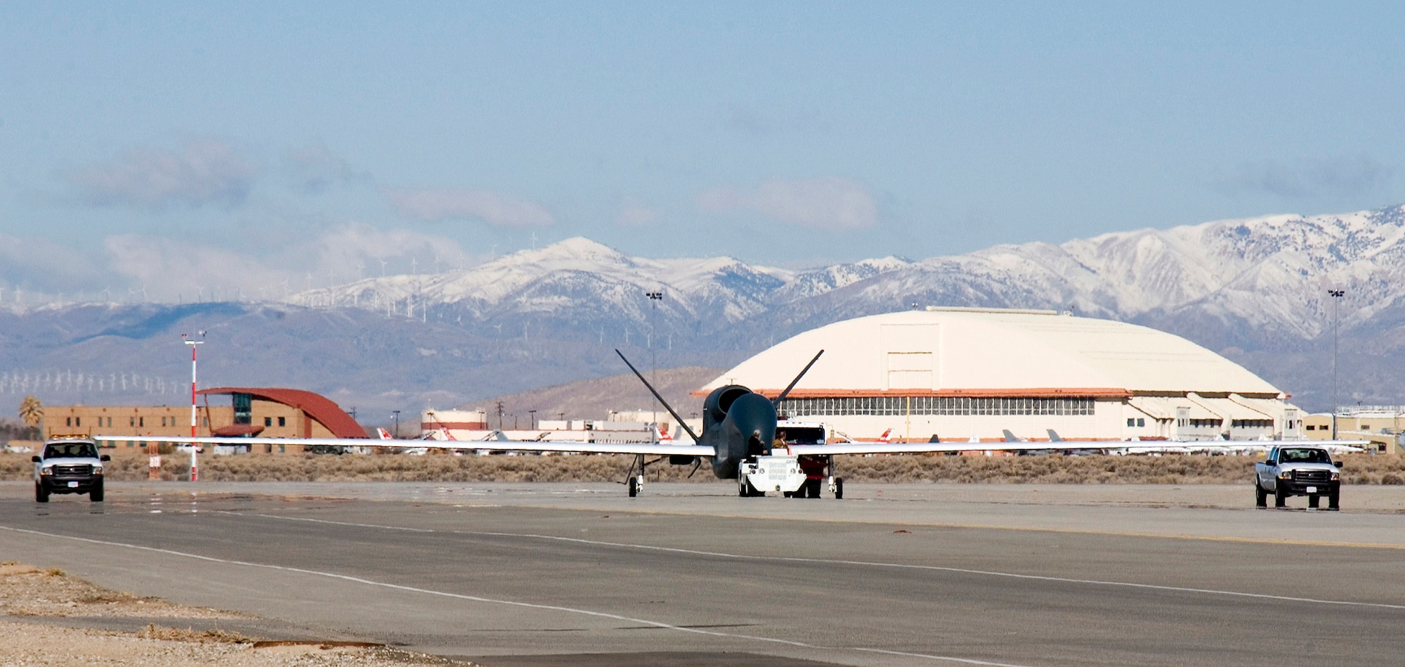The RQ-4 Block-20 Global Hawk lands on a runway here March 1, 2007. The Block-20 is the first in a series of Global Hawks including Blocks 30 and 40. The Global Hawk is undergoing 18 months of developmental and operational testing here. Developmental testing proves the hardware and software for safe flight and assures the aircraft meets the contract specifications, while operational testing verifies the use of the Block-20 in representative operational scenarios. (Photo by Chad Bellay)