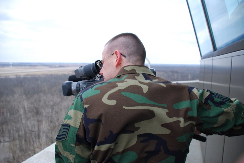 Public affairs members and unit public affairs representatives captured the moments the first C-40C plane arrived at Scott Air Force Base.  It was a historic day for the Air Force Reserve Command and the wing in Illinois.  TSgt. Chris Parr and TSgt. Dan Oliver raced across base to get up in the air traffic control tower just minutes before the plane touched down.  The commander piloting the plane was Lt. Gen. John Bradley, Chief of the Air Force Reserve Command.  Photo/ TSgt. Dan Oliver