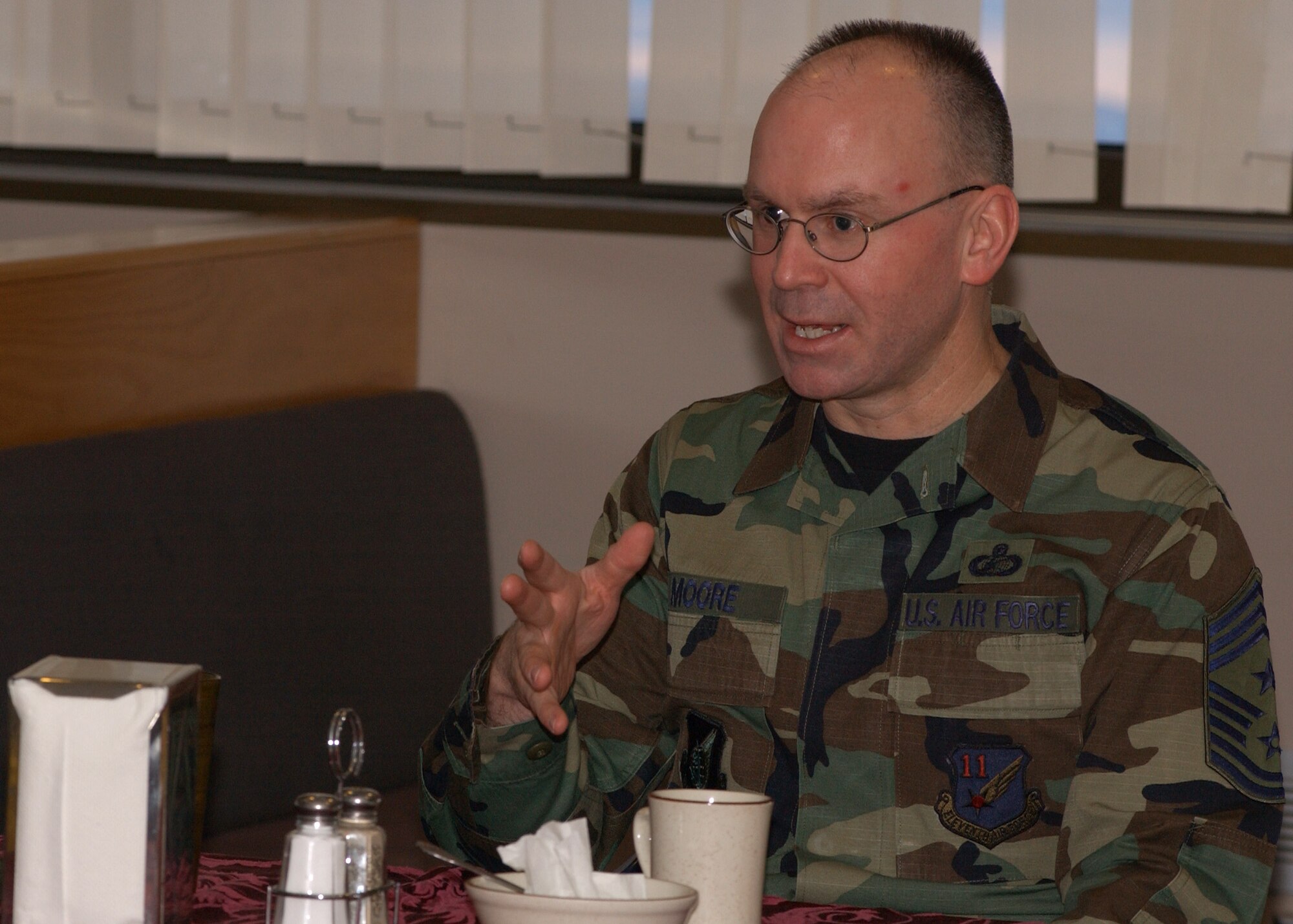 EIELSON AIR FORCE BASE, Alaska -- Command Chief Master Sgt. Robert Moore, 11th Air Force Command Chief, talks with members of Airman Committed to Excellence (A.C.E.) during breakfast at the Two Seasons Dining Facility on March 8. Chief Moore discusses with A.C.E. members about their impact and importance on base for quality of life projects and activities for Airman. (U.S. Air Force photo by Airman 1st Class Jonathan Snyder)