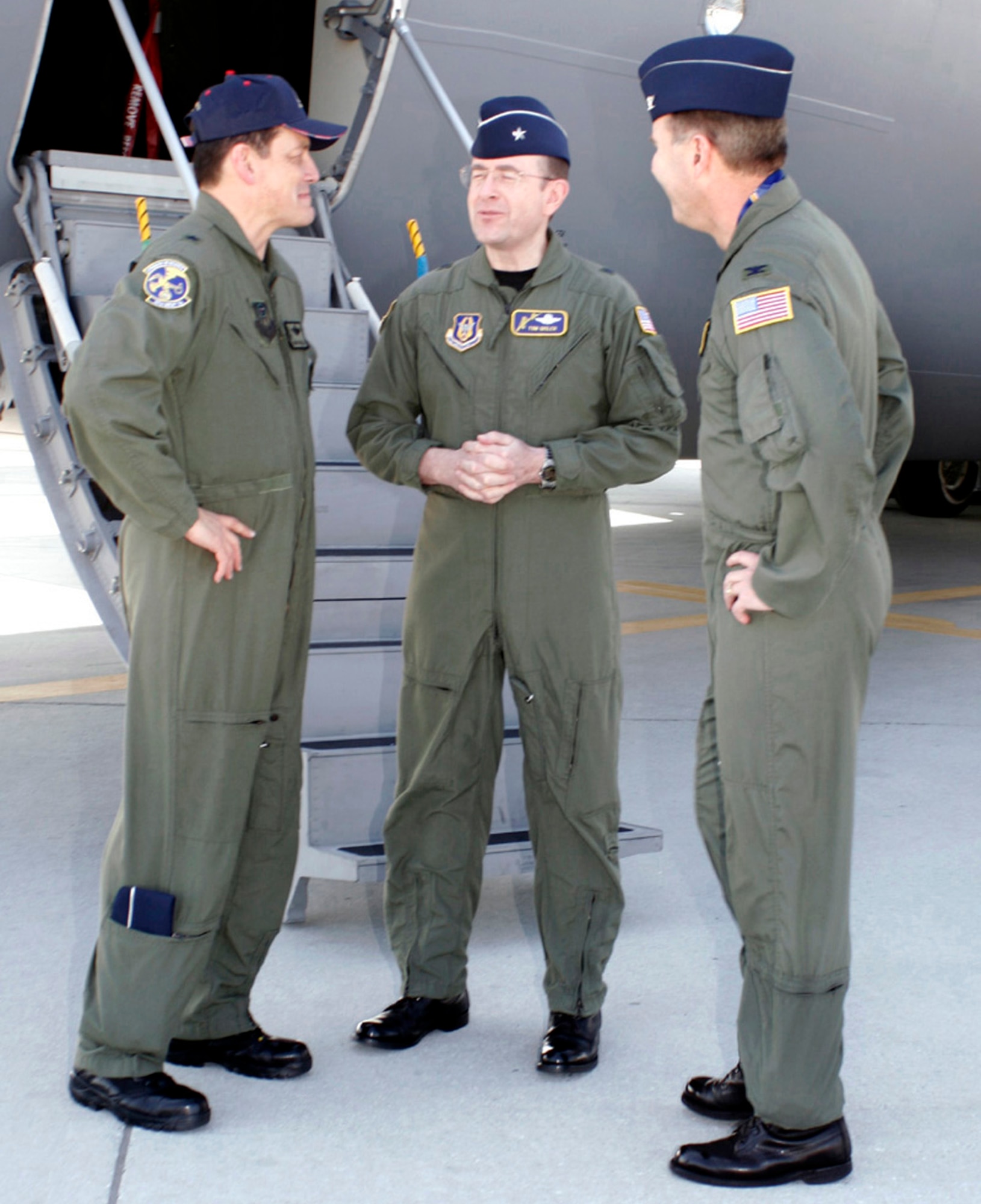 TRAVIS AIR FORCE BASE, Calif. – Team Travis and invited guests welcome the arrival of the ninth of 13 C-17 Globemaster III aircraft, Tuesday, March 6, 10 a.m., on the Travis Air Force Base flightline. Brig. Gen. Frank J. Padilla (left) is the Reserve mobilization assistant to the commander, Air Force Special Operations Command, Hurlburt Field, Fla., is welcomed by Brig. Gen. Thomas M. Gisler, Jr, Commander, 349th Air Mobility Wing (center) and Col. Stephen J. Arquiette, Commander, 60th AMW.  
(U.S. Air Force Photo by Ms. Laura Fentress)