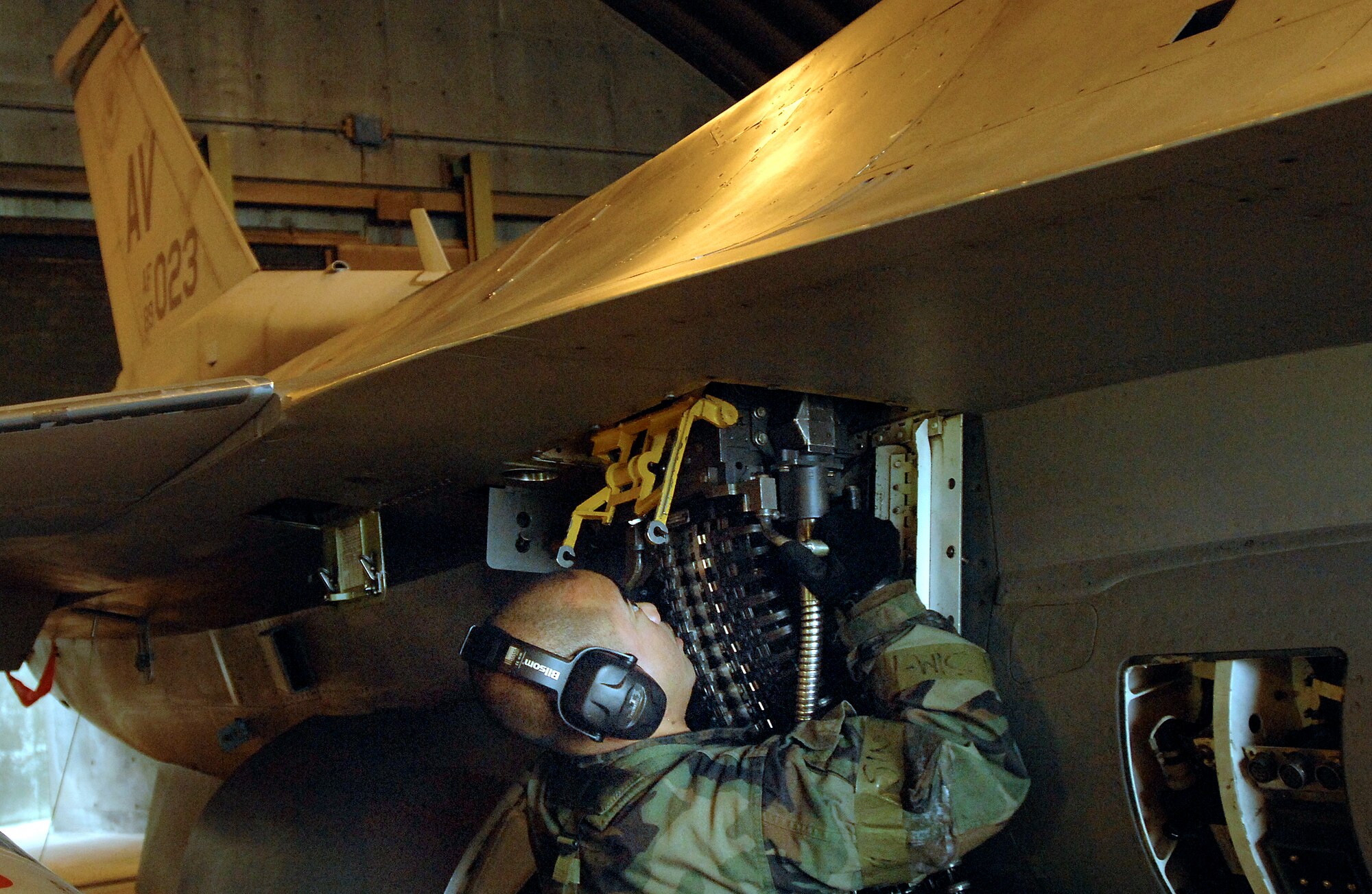 Staff Sgt. Joseph Sundita loads ammunition in to an F-16 Fighting Falcon March 8 during a NATO Tactical Evaluation at Aviano Air Base, Italy. The evaluation is to determine if Aviano's 31st Fighter Wing is prepared to support NATO Response Force 9/10.  Sergeant Sundita is with the 31st Aircraft Maintenance Squadron.  (U.S. Air Force photo/Airman 1st Class Liliana Moreno)