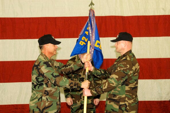 FAIRCHILD AIR FORCE BASE, Wash. -- Col. Van Fuller, 92nd Mission Support Group commander, passes the guidon to Lt. Col. Gregory Ottoman, incoming 92nd Civil Engineer Squadron commander, March 1 at the fire department. Colonel Ottoman comes to Fairchild from the Pentagon. (Photo by Senior Airman Chad Watkins)