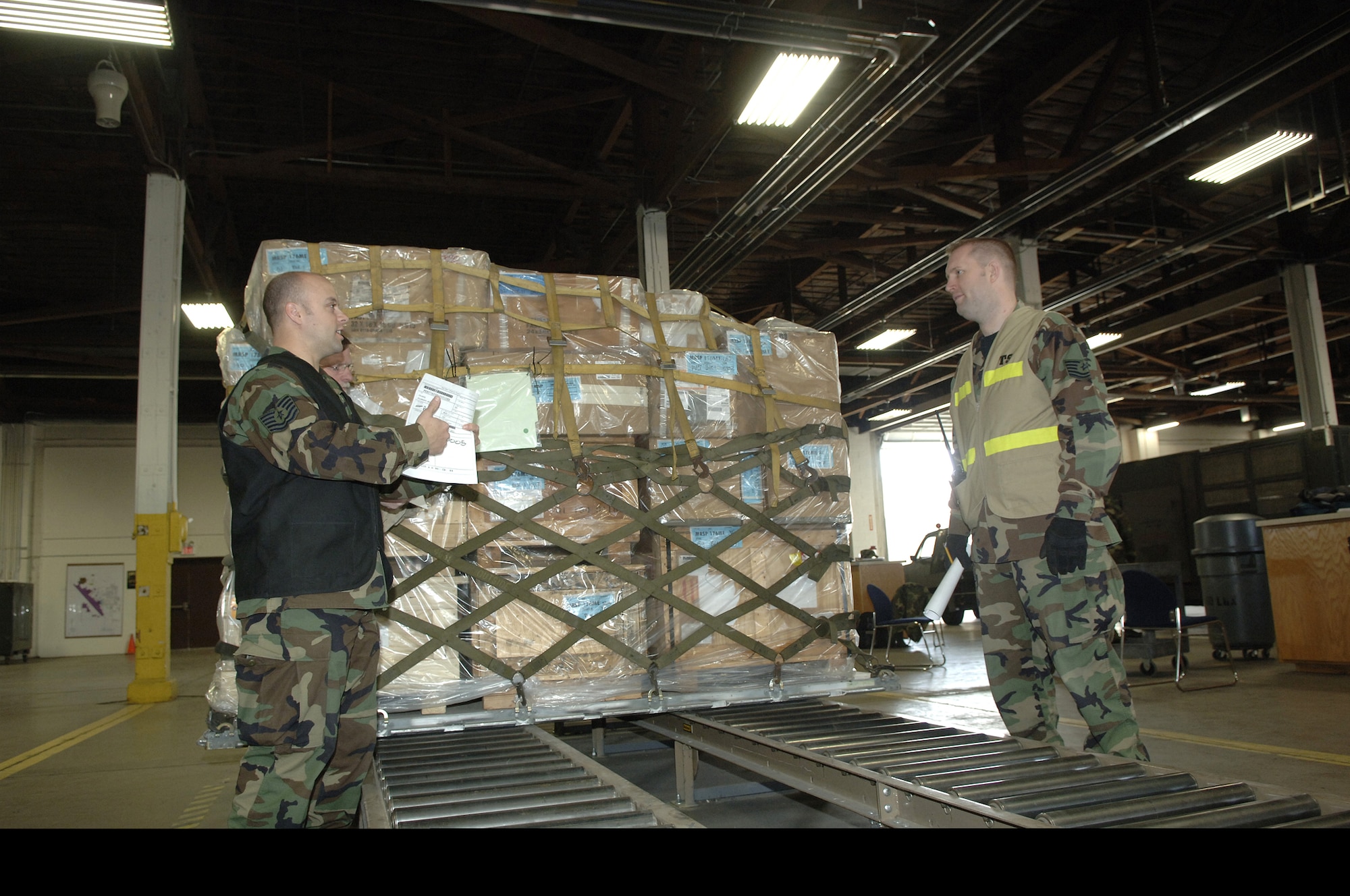 28th Bomb Wing Cargo Deployment Function team members check cargo at Ellsworth Air Force Base, S.D., March 5. Ellsworth conducted Badlands Express Phase 1 Operational Readiness Exercise 07-03 March 2 through March 7 in preparation for an operational readiness inspection in November. Ellsworth Airmen processed 272 tons of cargo and 451 passengers during the exercise. (U.S. Air Force photo/Staff Sgt. Michael B. Keller)