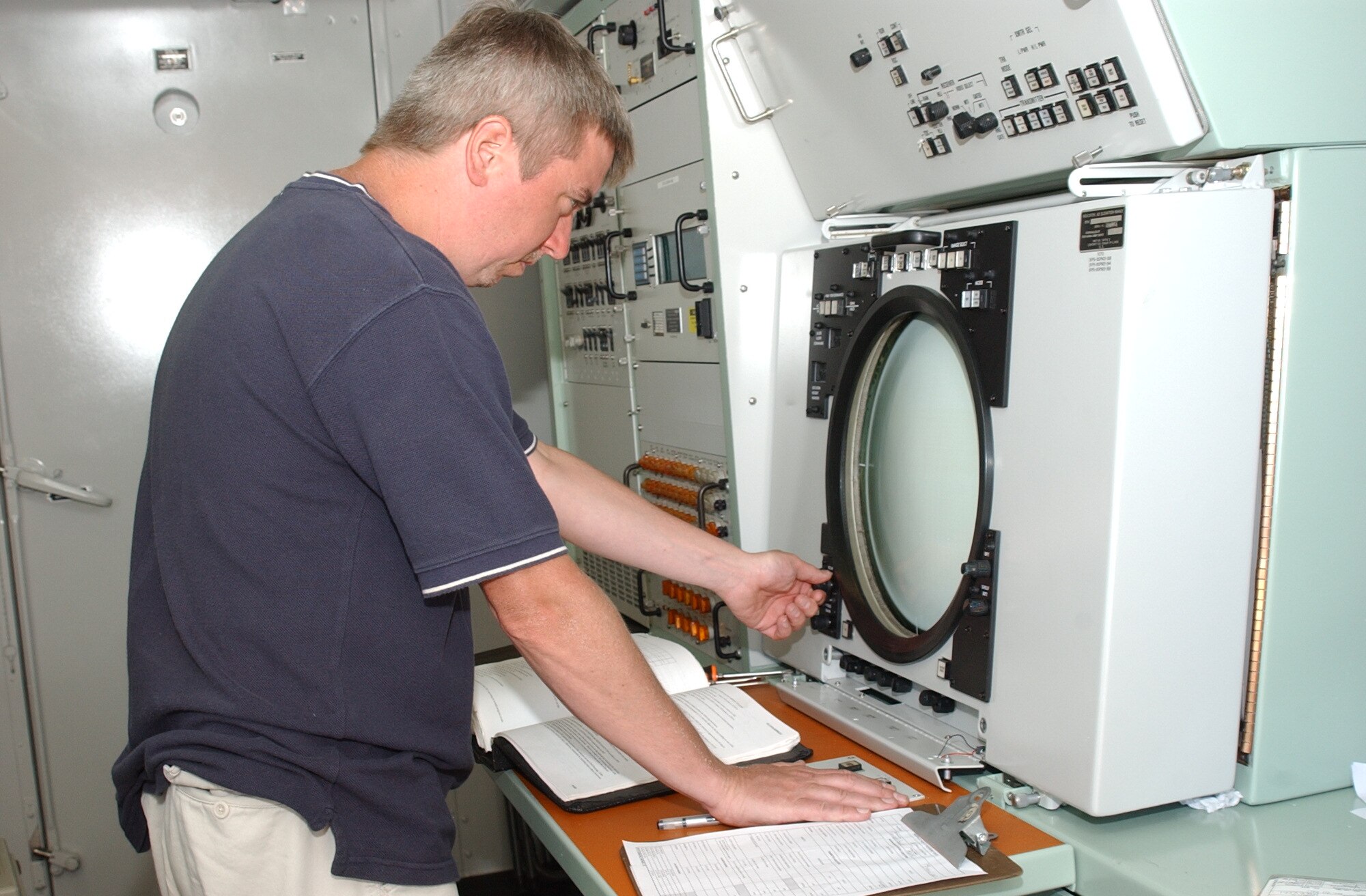 SOTO CANO AIR BASE, Honduras – Mike Moran, a Department of Defense civilian here from Tobyhanna Army Depot, Pa., checks the precision of the antenna beam position control unit after replacing the base’s ground position navigation radar system.  The Army/Navy GPN 22 provides precision guidance for aircraft within 20 miles of the base.  (U.S. Air Force photo/Tech. Sgt. Sonny Cohrs)