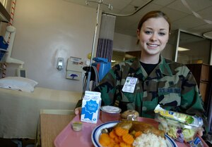 Airman 1st Class Karissa Barrows, 1st Medical Support Squadron Nutritional Medicine diet therapist, showcases the nutritional diet care inpatients receive here. Airman Barrows is one of 26 Airmen from the Air Force 2006 Nurtional Medicine team of the year. (U.S. Air Force photo/Senior Airman Austin Knox) 