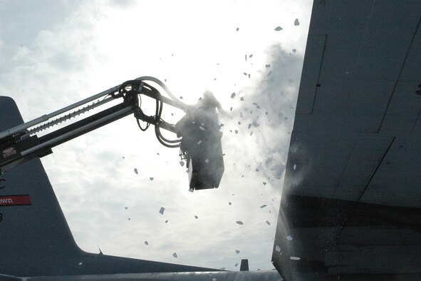 YOUNGSTOWN AIR RESERVE STATION, Ohio - Air Force Reserve Tech. Sgt. Kevin L. Bowser, an aerospace maintenance specialist, blows heavy snow from the wing of a C-130 on the flight line here on March 7. Tech. Sgt. Bowser is perched in the lift bucket of a vehicle known as a "Huffer" that utilizes a small jet engine to feed super-heated air through hoses on the vehicle to a nozzle mounted on the lift bucket. The cold weather gear-clad ground crew members were removing the snow while preparing the aircraft for flight in below-freezing conditions. U.S. Air force photo/ Tech. Sgt. Bob Barko Jr. The aerospace maintenance field is just one of a vast number of opportunities available in the Air Force Reserve.  For more information about serving in the Air Force Reserve visit: http://www.youngstown.afrc.af.mil/units/recruiting/  