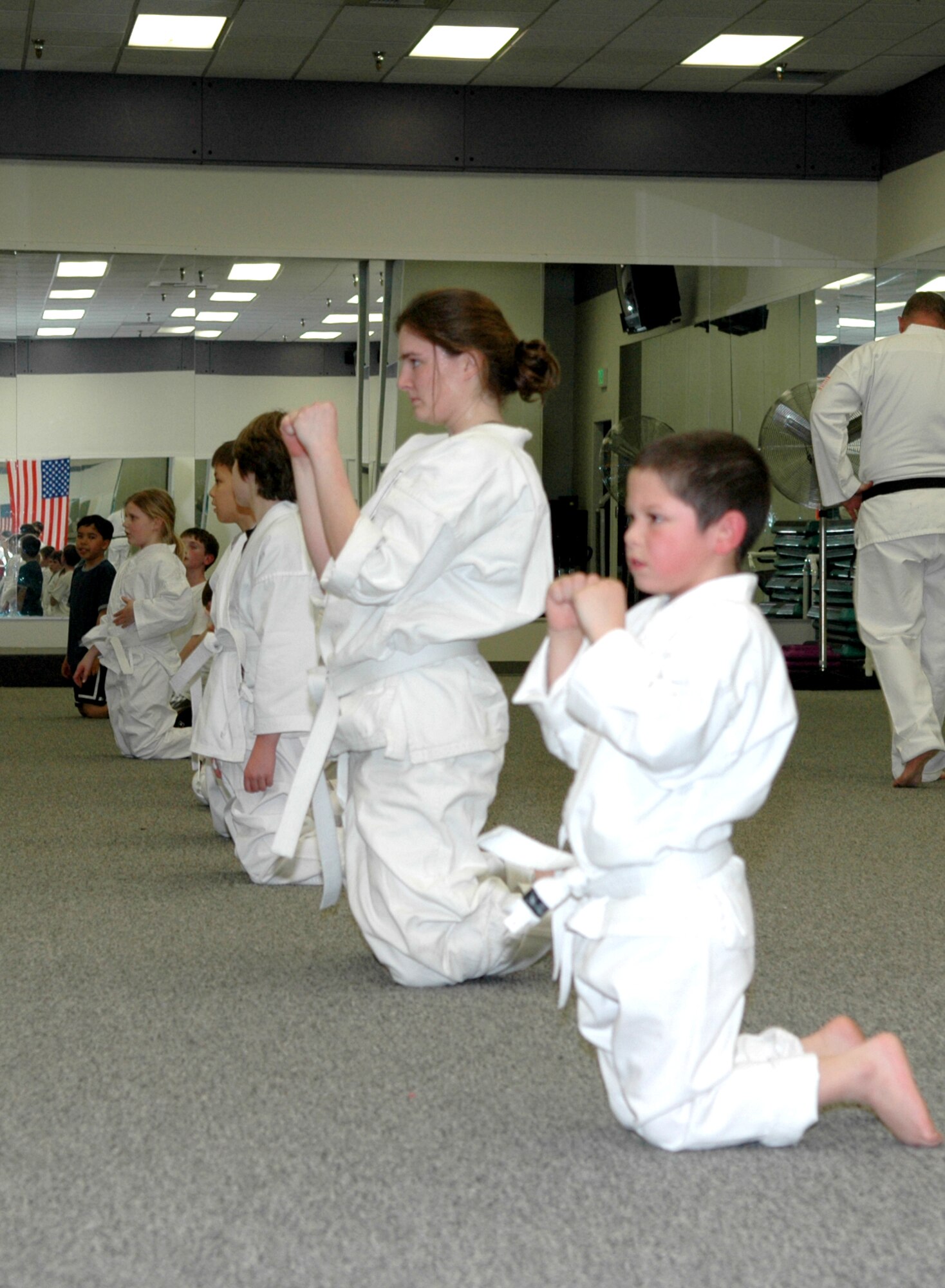 FAIRCHILD AIR FORCE BASE, Wash. -- Shotokan Karate students prepare to complete Monday’s evening class. The free class, taught by Bruce Ward, is available at the Fitness Center 6-7:30 p.m. every Monday and Wednesday. Mr. Ward has 16 years of experience as a karate and self-defense instructor and holds a second-degree black belt in Shotokan Karate. He has trained in Hapkida, Judo and full-contact martial arts. His class focuses on self-discipline, self-defense and self-motivation. (Photo by Staff Sgt. Kristian Carter)
