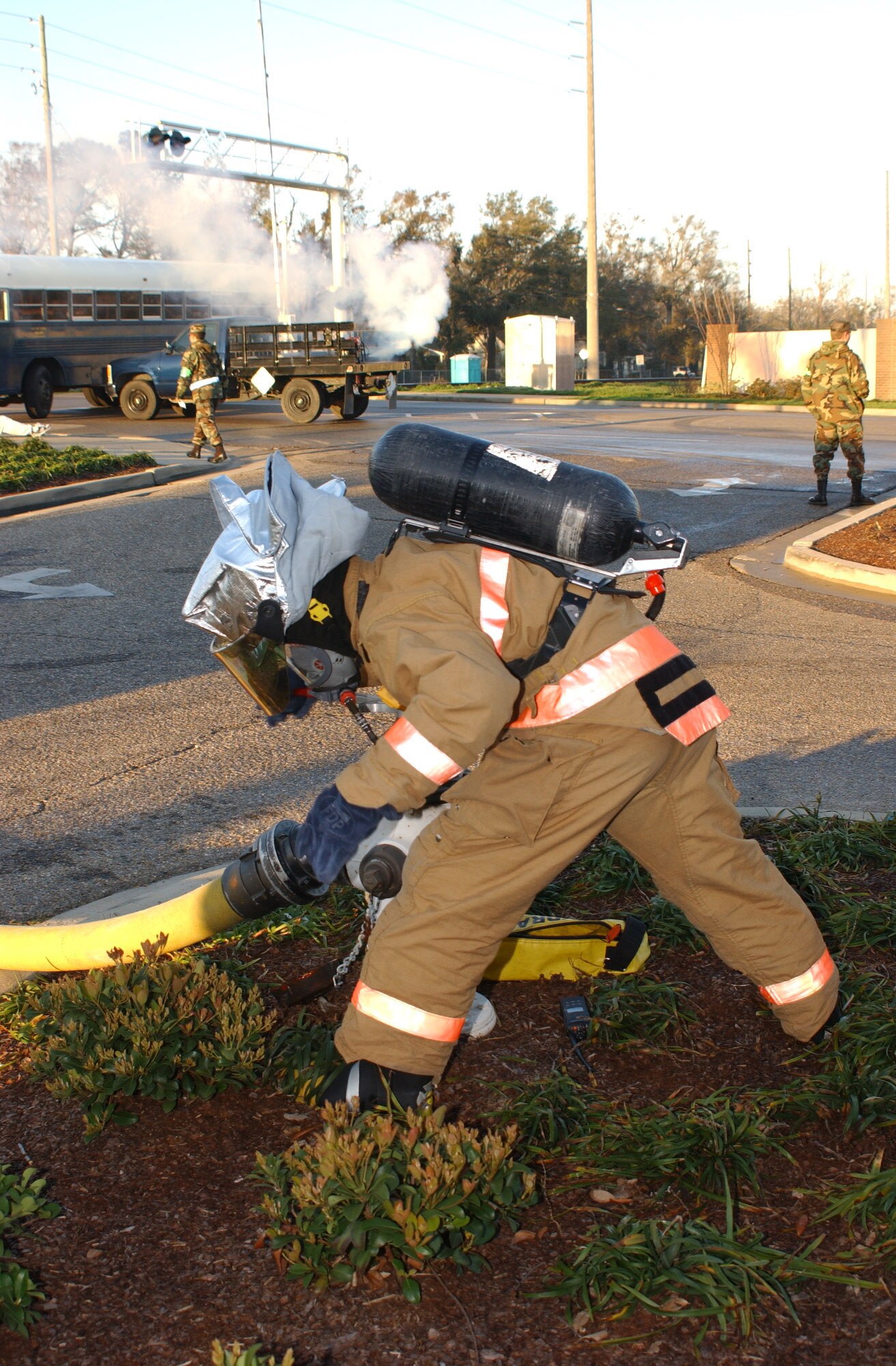 Airman 1st Class Shawn Edgecomb, 81 Civil Engineer Squadron, Keesler Air Force Base, attaches a hose to a fire hydrant in order to put out a simulated train derailment and building fire during a major accident response exercise today.  The exercise was designed to test Biloxi and Keesler Air Force Base first-responders' ability to work together.  (U.S Air Force photo by Kemberly Groue)  