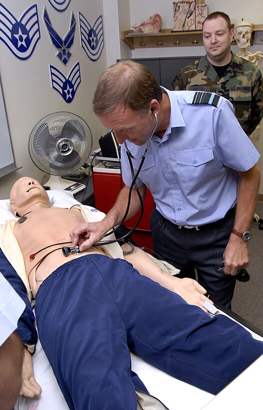 British Royal Air Force Air Marshal Barry Thornton, Commander in Chief of Personnel and Training Command, checks the vitals on a "patient" during his visit March 6 at Sheppard Air Force Base, Texas. Air Marshal Thornton spent the day at Sheppard visiting training locations across base. (U.S. Air Force photo/Harry Tonemah)