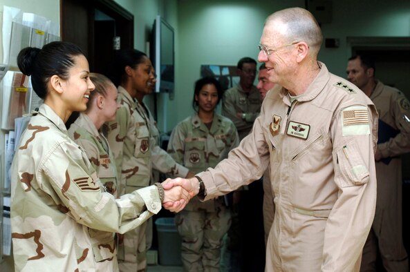 Staff Sgt. Tommie Wyatt, 386th Expeditionary Medical Squadron, greets Lt. Gen. (Dr.) James Roudebush, Surgeon General of the Air Force, at the EMEDS building Feb. 23rd. The General visited EMEDS and the CASF during his tour of the CENTAF Area of Responsibility.  "I like seeing where the iron is really getting hauled," said Gen. Roudebush.