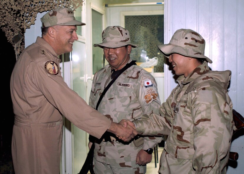SOUTHWEST ASIA -- Lt. Gen. Gary L. North, Commander, 9th Air Force and U.S. Central Command Air Forces introduces himself to K. Yano and M. Ishimura, members of the Japan Air Self Defense Force (JASDF) at an undisclosed location in Southwest Asia last Saturday night.  USAF Photo by TSgt Edward D. Holzapfel (RELEASED)