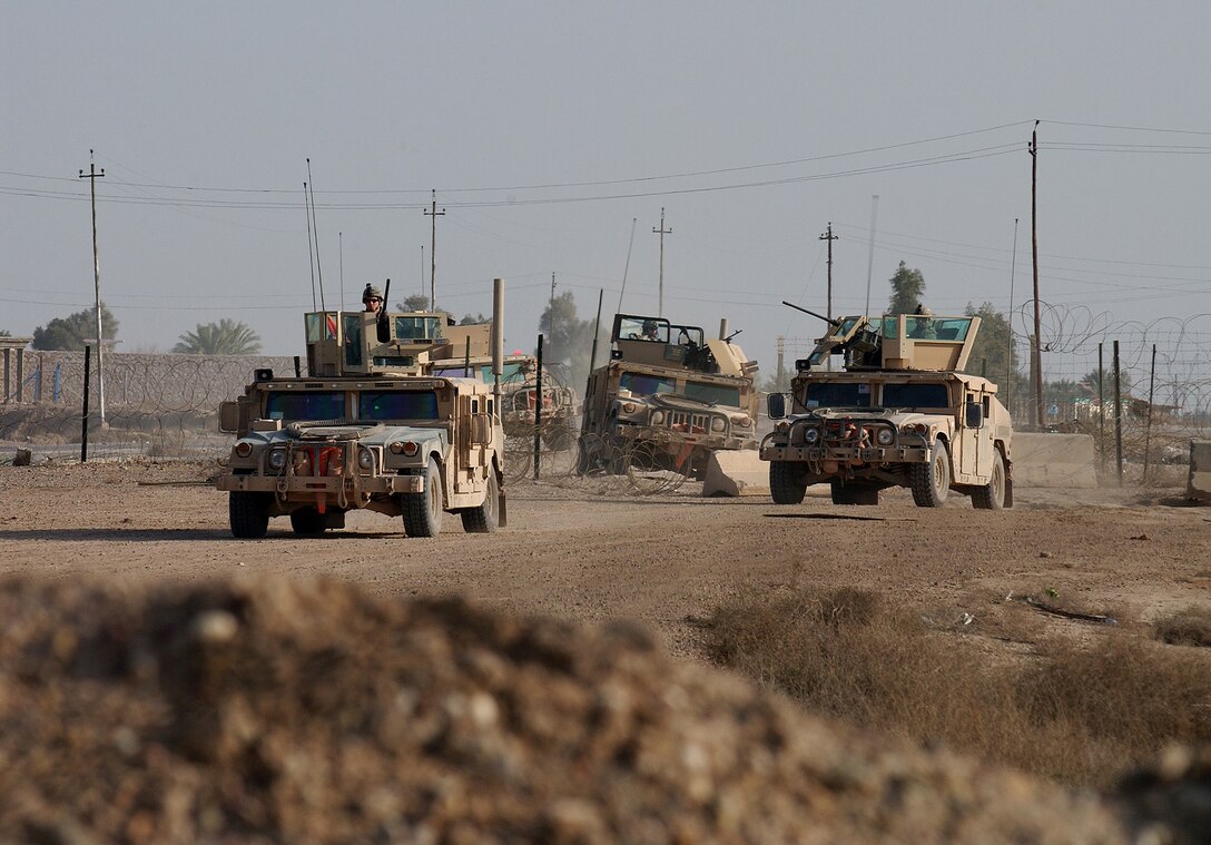 A convoy of U.S. Army soldiers approaches an Iraqi checkpoint outside Samarra, Iraq, Feb. 27, 2007.