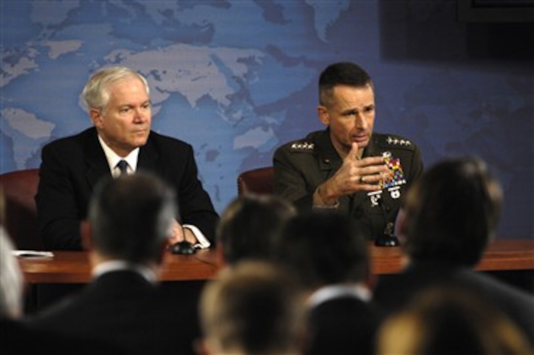Chairman of the Joint Chiefs of Staff Gen. Peter Pace (right), U.S. Marine Corps, answers a reporter's question during a press conference with Secretary of Defense Robert M. Gates at the Pentagon in Arlington, Va., on March 7, 2007.  