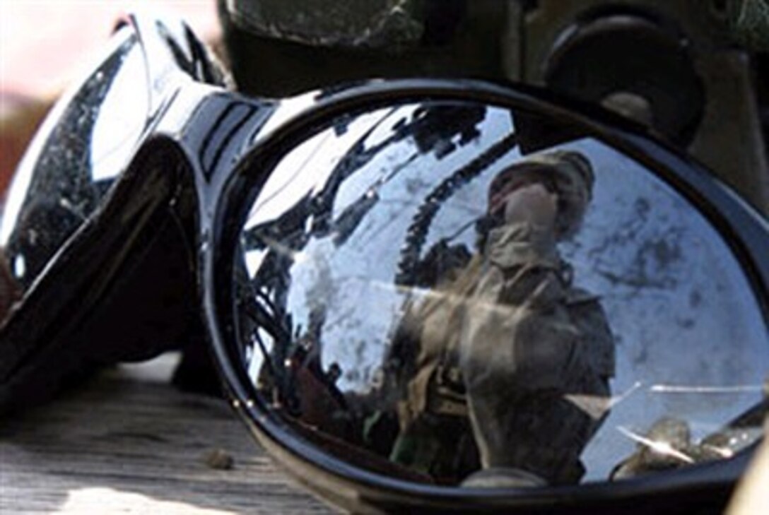 U.S. Marine Corps Cpl. David Donaldson, a scout observer assigned to Company I, 3rd Battalion, 8th Marines, calls in fire support during a Fire Support Team exercise held at Camp Lejeune, N.C., Feb. 28, 2007. 