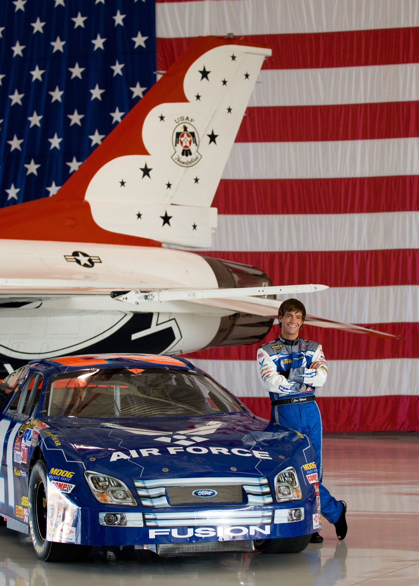 Jon Wood, driver of the Air Force car, poses in the Thunderbird hangar at Nellis Air Force Base, Nev., March 8.  Wood is at Nellis visiting Airmen before his NASCAR Nextel Cup UAW Daimler-Chrysler 400 race March 10. (U.S. Air Force Photo/Master Sgt. Robert W. Valenca)    