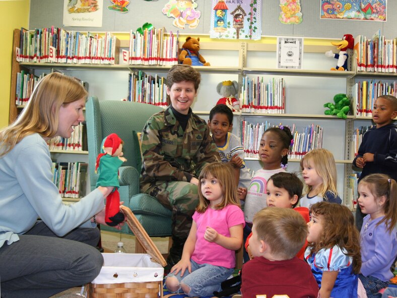 EGLIN AIR FORCE BASE, Fla. -- Rebecca Donnelly and her puppet Kafka introduce Col. Theresa Giorlando, 96th Mission Support group, to kick off Women's History Month at the base library with a special appearance at Preschool Story Time March 6 with the reading of four books. Colonel Giorlando spoke to a group of 43 preschoolers, parents and caregivers about "the things that little girls can grow up to be." (U.S. Air Force photo by Dorothee Bennett)