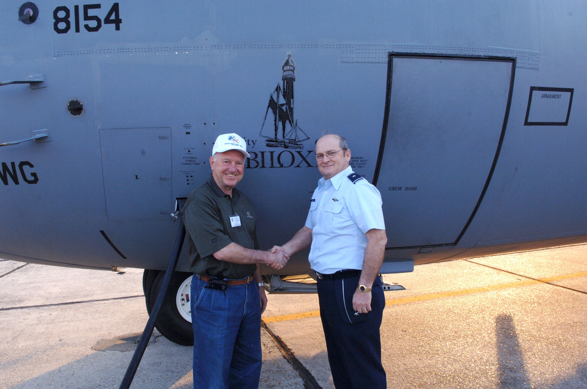 KEESLER AIR FORCE BASE, Miss. -- Biloxi Mayor, A.J. Holloway, shakes hands with Brig. Gen. Rich Moss, commander, 403rd Wing after a two-day civic leader tour aboard the C-130J-30 aircraft named the "Spirit of Biloxi." The Civic Leader Tour is an annual event that showcases the many missions and capabilities of the Air Force Reserve. This was Holloway's first flight aboard the aircraft named for his city. (U.S. Air Force Photo/Tech. Sgt. James B. Pritchett)