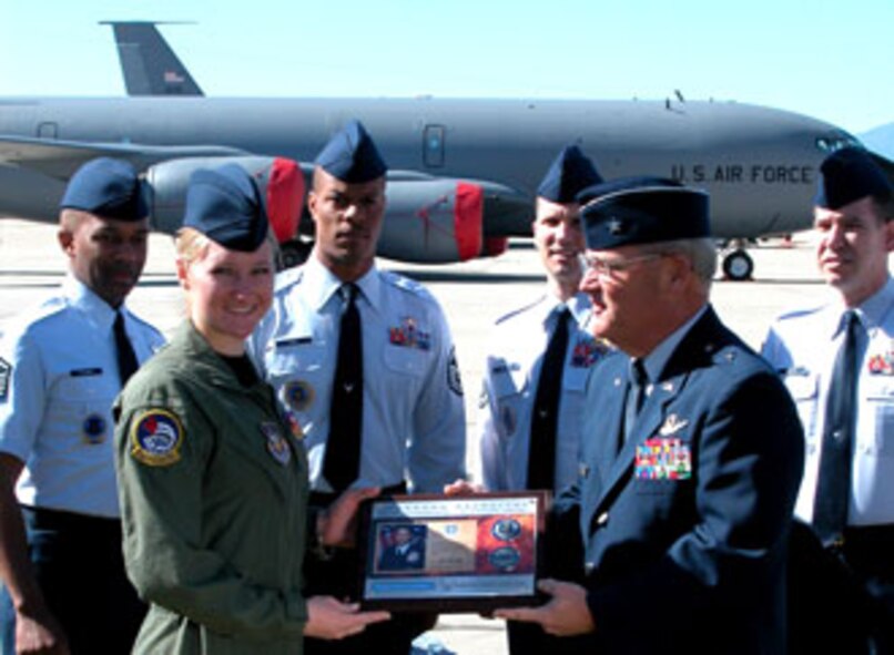 Senior Airman Lyndsey Wisniewski, 452 AES, receives a plaque and coin from Brig. Gen. James Melin, 452 AMW commander, for her contribution to the Air Force Reserve “Get One” recruitment program. In addition, the award presentation was filmed by a production company which will use the footage to promote the Air Force Reserve. The program is open to all Air Force reservists, with the exception of AFRC Recruiters, their family members and Reserve liaisons. The Get One awards are primarily commemorative coins. For every referral submitted, the reservist receives a Referral Coin Award numbered one through ten, the number corresponding to the number of referrals. Accession coins are fashioned after commander’s coins and are awarded to reservists when a referral turns into an accession. Coins are awarded from one through four accessions. The award for the fifth accession is a leather portfolio and pen and the sixth accession is a pair of pewter steins. For more information go to http://get1now.us (U.S. Air Force photos by Maj. Don Traud)