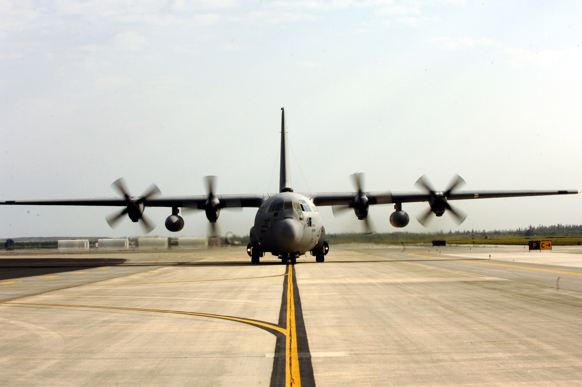 A C-130 Hercules arrives at Homestead Air Reserve Base, Fla., March 4 to be loaded with supplies. U.S. Southern Command, in cooperation with the U.S. Agency for International Development, is delivering the supplies in response to devastating floods in Eastern Bolivia. (U.S. Army photo/Spc. Clayton Corey)