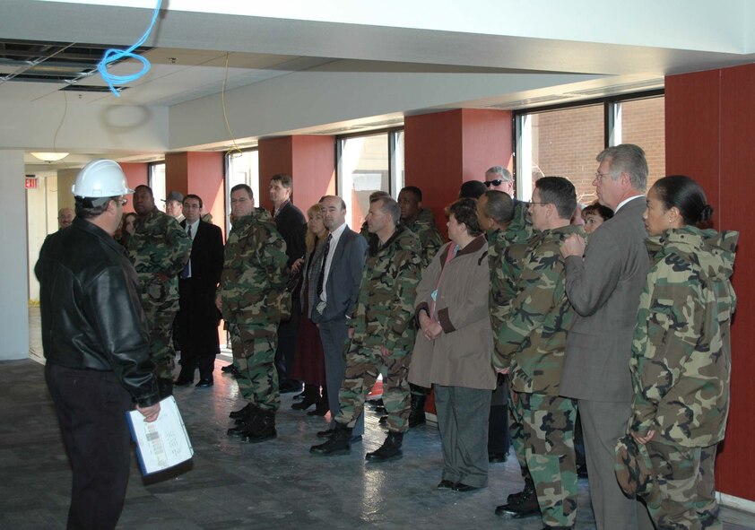 Alan Temple, 28th Civil Engineer Squadron project engineer, leads an Air Force Financial Services Center tour at Ellsworth Air Force Base, S.D., Feb. 28 through the new center's A-wing. When the center becomes fully operational in October 2008, it is expected to bring 750 additional jobs to the surrounding area. (U.S. Air Force photo/Airman Nathan Riley)