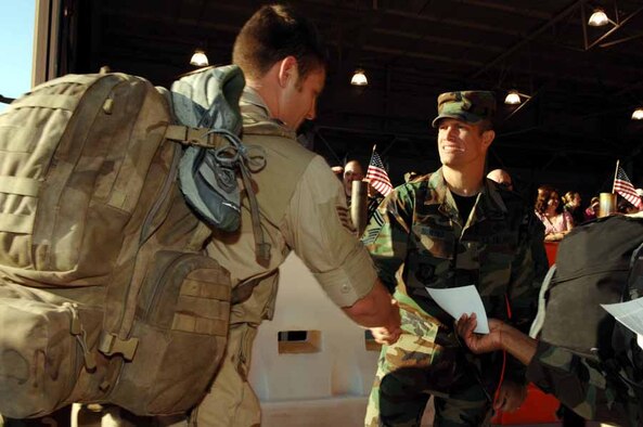 Airmen are greeted as they enter Freedom Hangar Wednesday after returning from deployments to Southwest Asia. (Courtesy photo)