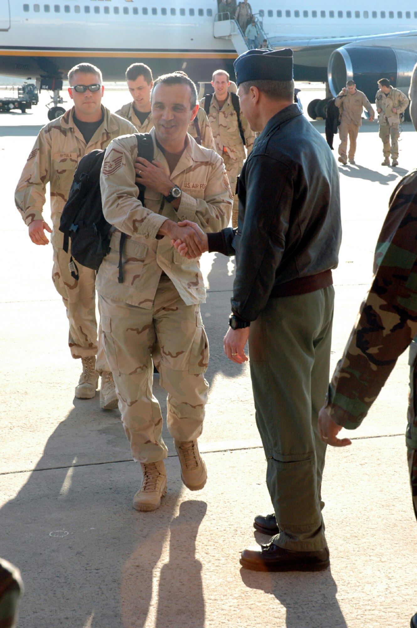 Airmen are greeted as they enter Freedom Hangar Wednesday after returning from deployments to Southwest Asia. (Courtesy photo)