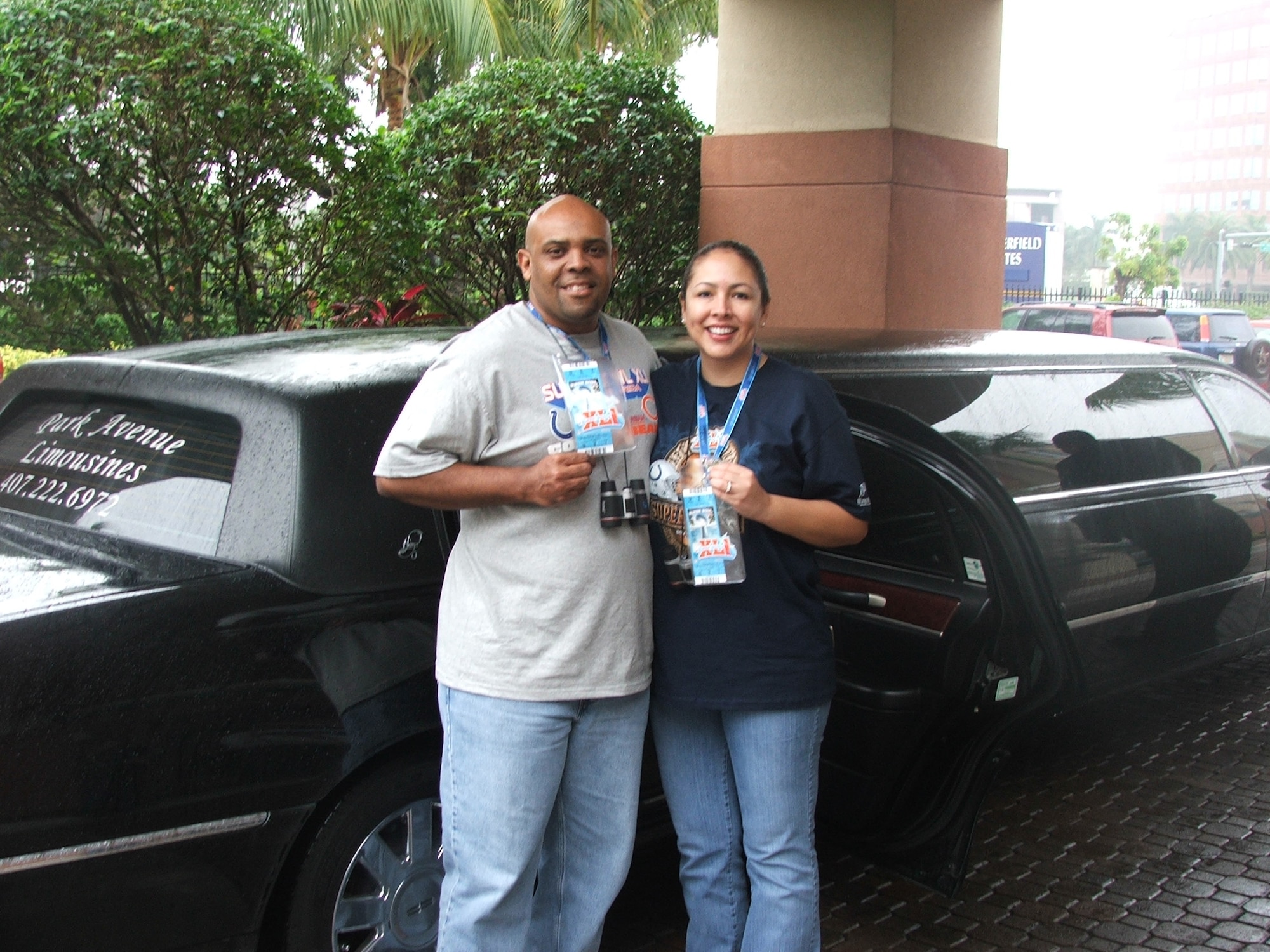 First Lt. Lisa Charles, 305th Civil Engineer Squadron section commander, and her husband, PJ, show off their Super Bowl passes in front of their hotel in Florida.  