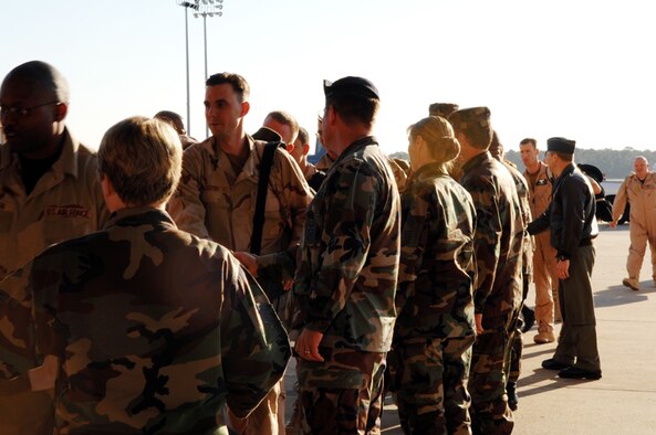 Airmen are greeted by wing leadership Wednesday after returning from deployments to Southwest Asia. (Courtesy photo)