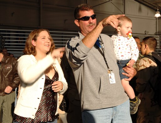 Family members look on anxiously as more than 200 Airmen returned from deployments to Southwest Asia Wednesday. (Courtesy photo)