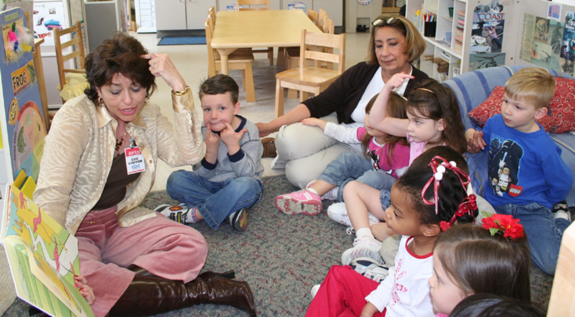Dr. Alexis Tibbetts, Okaloosa County superintendent of schools, reads to children in the child development center March 2 for Read-Across-America. (U.S. Air Force photo by Amy Oliver)