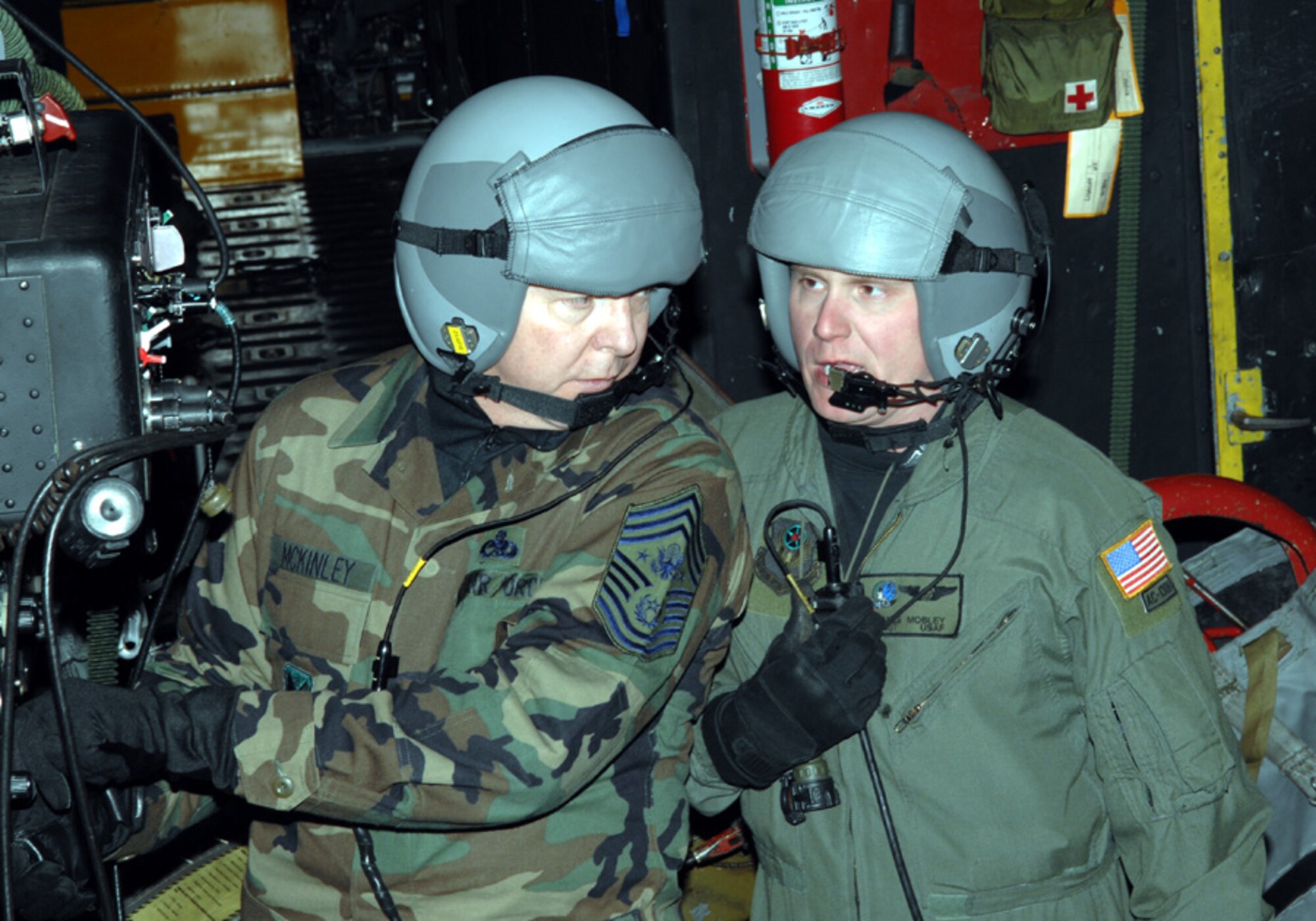 Chief Master Sgt. of the Air Force Rodney J. McKinley chats with Staff Sgt. James Mobley, 16th SOS, during his orientation flight on an AC-130H Monday night. The chief visited Hurlburt Monday and Tuesday. (U.S. Air Force photo by Senior Airman Andy Kin)