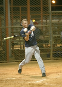 Lackland Warhawks third baseman Tony Formell swings hard against CFA Bomb Squad during the first game of the San Antonio Parks and Recreation Spring Softball League March 6 at the Alva Jo Fischer Memorial Softball Complex. Formell went 2-for-3, doubled and scored. (USAF photo by Robbin Cresswell)