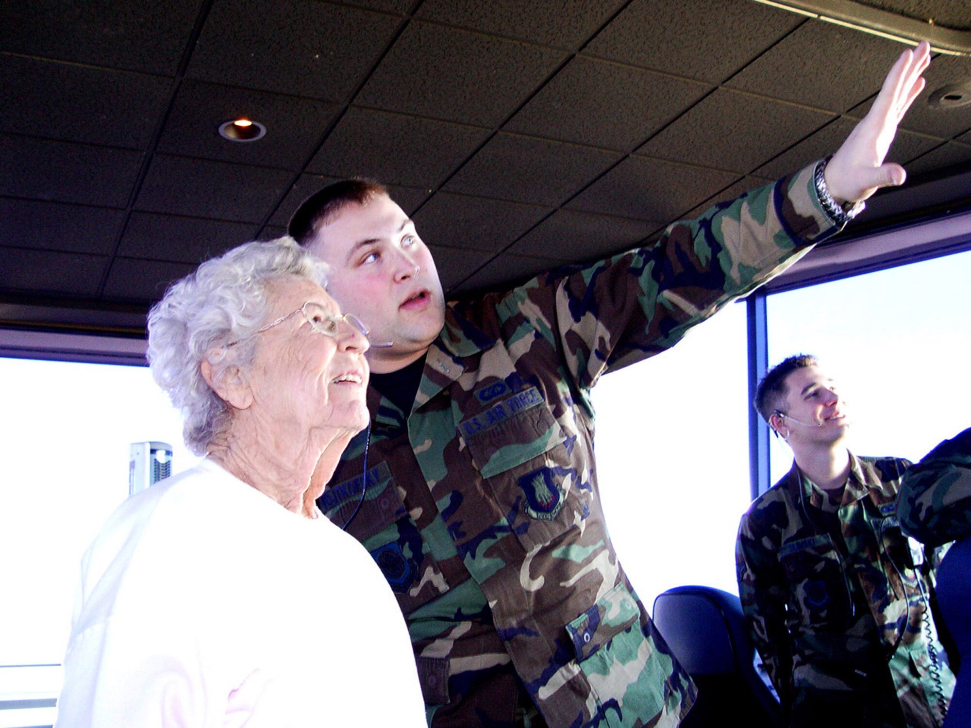 Senior Airman Robert Vojtkofsky, 22nd Operations Support Squadron air traffic controller, shows Mary Chance VanScyoc, the first civilian, female air traffic controller in the United States, around McConnell’s air traffic control tower Feb. 28. Airman Vojtkofsky gave Ms. VanScyoc a tour of the tower in honor of Women’s History Month, which is March. Ms. VanScyoc began here career as an air traffic controller in June, 1942, at the Denver Airway Traffic Control Center in Denver, Colo. She also worked as a controller in Wichita from 1944 to 1945. Today, she has a job at the Kansas Aviation Museum in Wichita. (Air Force photo by Senior Airman Amanda Currier)                               