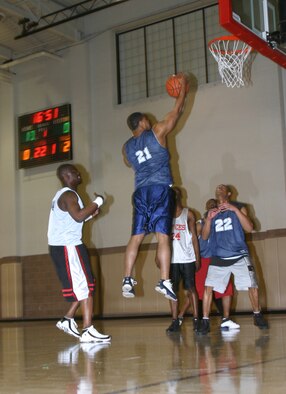 Delta Company, 264th Medical Battalion player George Hall goes in for a layup during the intramural basketball championships March 5 at the Levitow Fitness Center. The 82nd Civil Engineer Squadron defeated the Delta 264th, 52-50. (U.S. Air Force photo/Airman 1st Class Jacob Corbin)