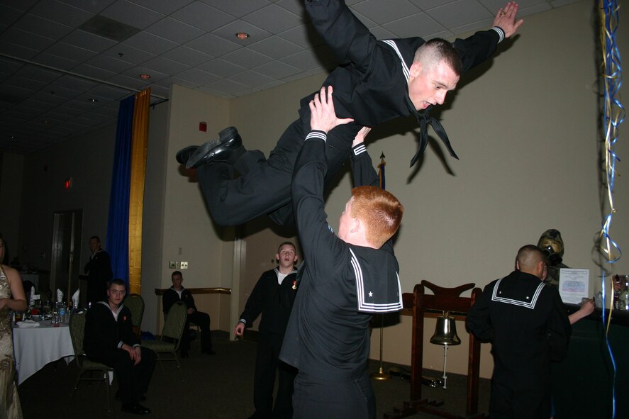 Seamen participate in the "golden oldies" dance competition during the Seabee Ball at the Howard Johnson Plaza Hotel March 3. (U.S. Air Force photo/Staff Sgt. Tonnette Thompson)