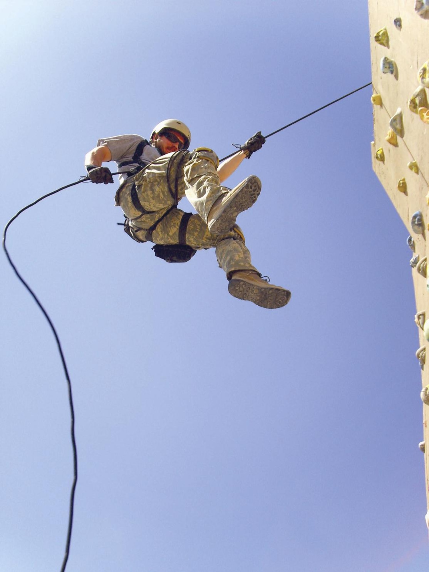 Pararescueman Air Force Staff Sgt. Joseph Piccoli, 306th Rescue Squadron, rappels off the rock wall at Kandahar Airfield, Afghanistan, during a training exercise. (U.S. Air Force photo/Senior Airman Andrea Wright)