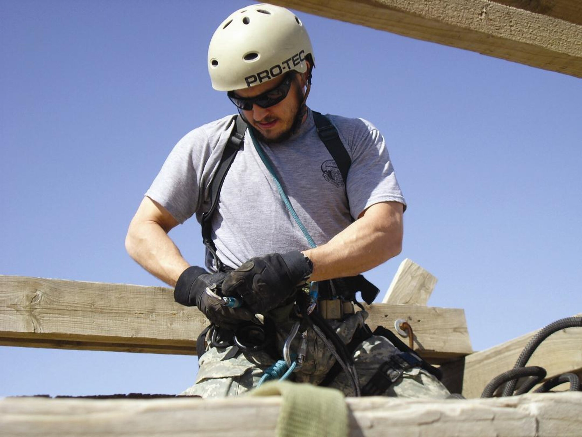 Air Force Staff Sgt. Joseph Piccoli, 306th Rescue Squadron pararescue specialist, clears the rope before his fellow pararescueman climbs up the rock wall during a training exercise. (U.S. Air Force photo/Senior Airman Andrea Wright)