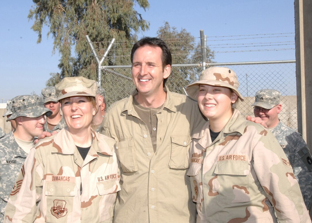 BALAD AIR BASE, Iraq -- “I wanted to express face-to-face our state’s continued appreciation and respect for the men and women from Minnesota who are serving here under very difficult circumstances,” Governor Tim Pawlenty (R-Minn.) said. “We want them to know we continue to think of them and their families. They are awesome people and make Minnesota proud.” Above, the governor poses for a photo with Minnesota Air National Guard Senior Master Sgt. Marcia Dumancas and her daughter, Airman 1st Class Leilani Dumancas deployed from the 148th Fighter Wing at Duluth ANG Base to the 332nd Air Expeditionary Wing. (U.S. Air Force photo/Staff Sgt. Amie Dahl)