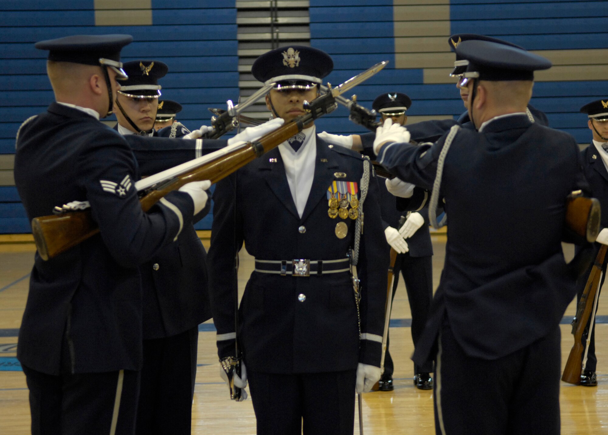 The United States Air Force Honor Guard Drill Team performs for students of Canyon Springs High School, Las Vegas, Nev., March 8, 2007. The Drill Team is the traveling component of the Air Force Honor Guard and tours Air Force bases world wide showcasing the precision of today's Air Force to recruit, retain, and inspire Airmen for the Air Force mission. (U.S. Air Force photo by Airman 1st Class Rusti Caraker)(Released)